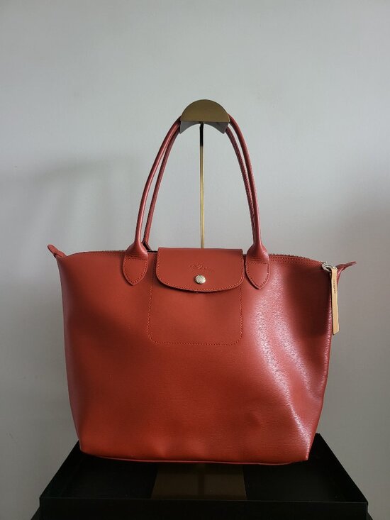 Longchamp Handbags - Classic Longchamp rust /orange colored Le Pliage leather tote